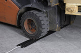 EV charger cable cover, pavement.